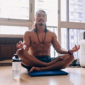 fit martial arts man meditating